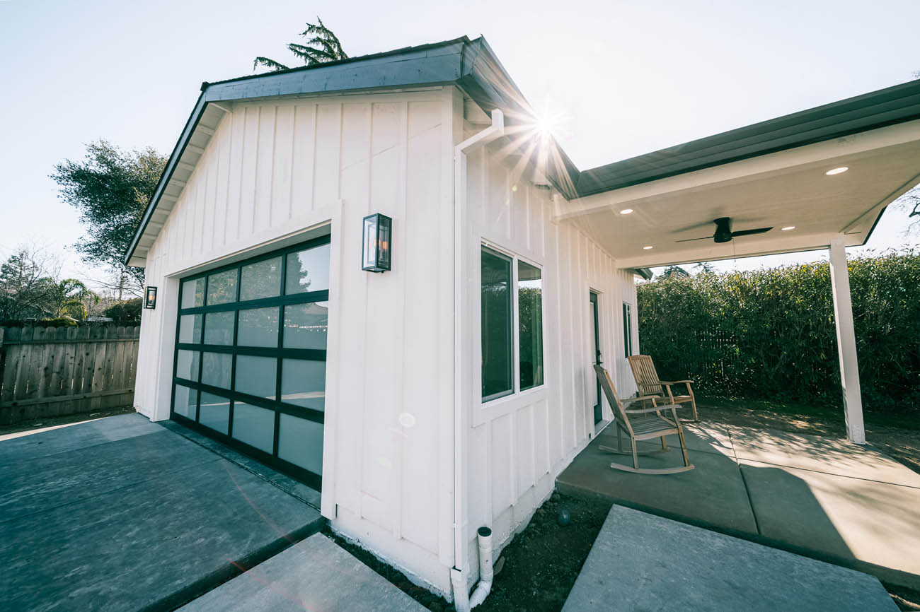 A white barnhouse style garage that has been converted into an ADU by our garage conversion contractors in {fan_territory_name}.