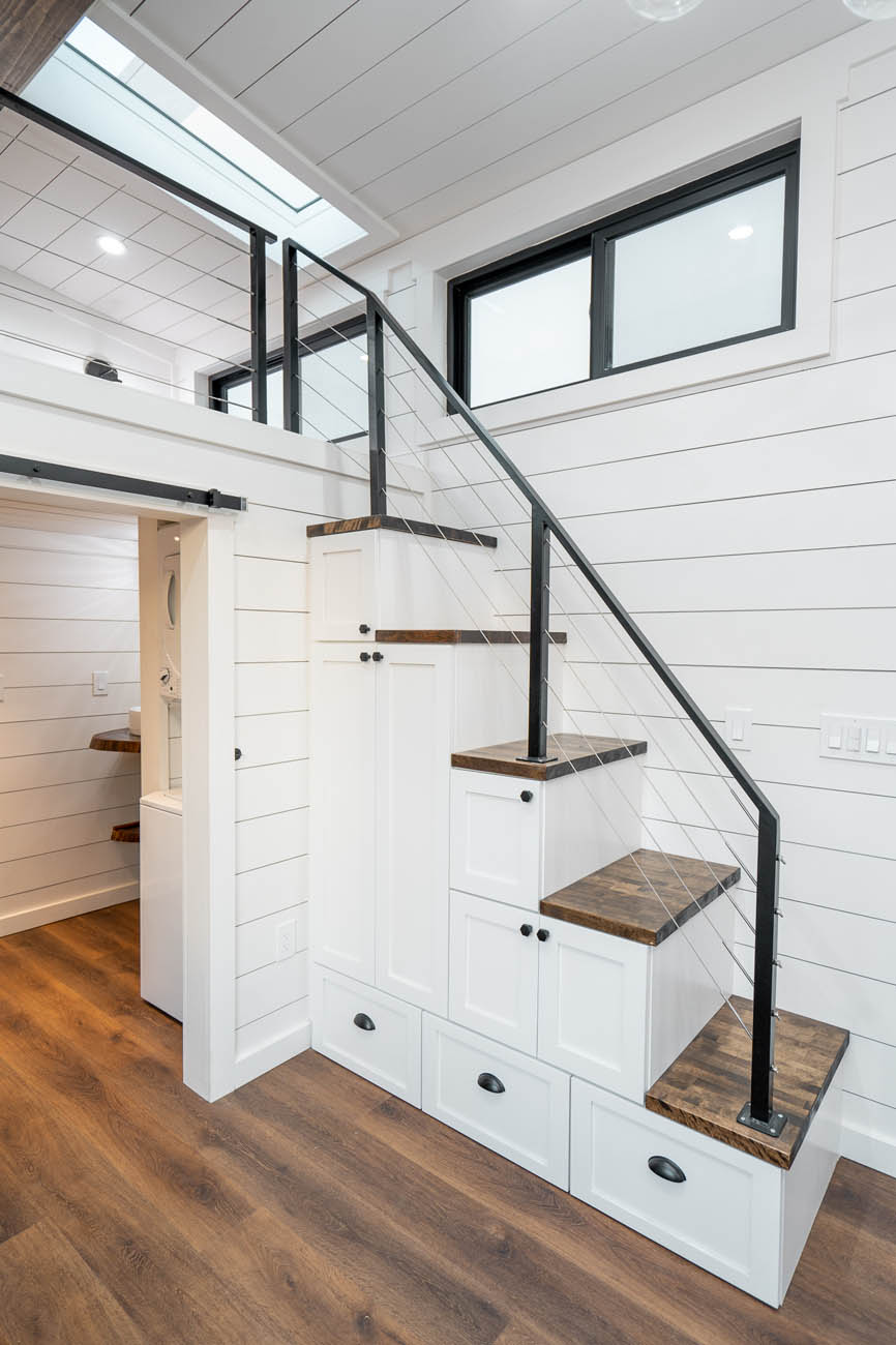 Inside of an ADU with dark wood flooring, provided by our modern tiny home builders.